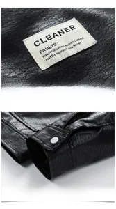 Close-up of black leather jacket featuring pebble grain texture and metal button cuffs