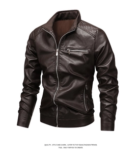 Detailed view of quilted shoulders and zipper pockets on dark brown biker leather jacket