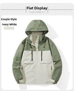 Detail view of ivory and green hooded jacket with waterproof zippers and drawstring hood