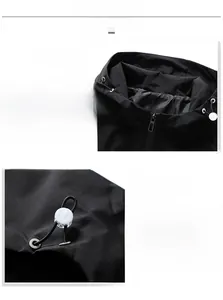 Detail view of the drawstring hood and windproof zipper on the black functional jacket
