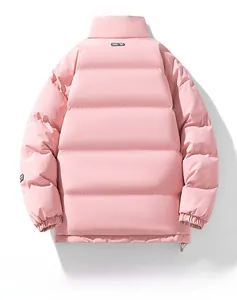 Detail view of pink stand-collar winter jacket featuring quilted pattern and elastic cuffs