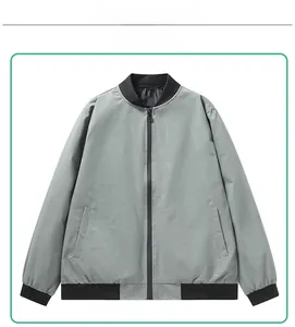 Detail view of grey bomber jacket with geometric print and black ribbed collar