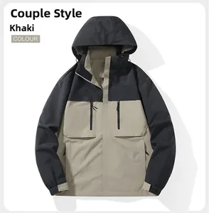 Detail of khaki outdoor hooded jacket featuring adjustable drawstring and zipper pockets