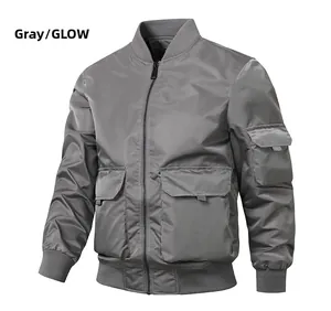 Close-up detail of grey bomber jacket showing windproof fabric and utility pockets