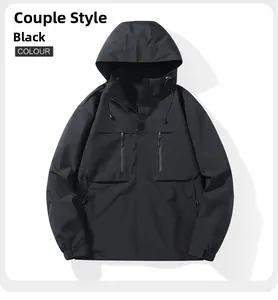 Close-up of black hooded outdoor jacket with functional vertical zipper pockets