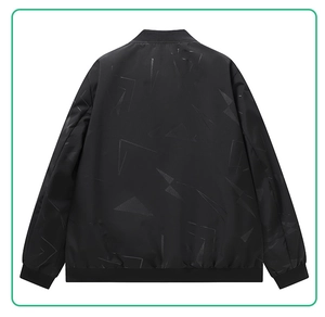 Macro shot of men's black bomber jacket with matte geometric patterns and ribbed trims