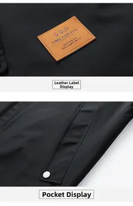 Detail of black jacket featuring a brown leather G.O.D patch and silver snap pocket button