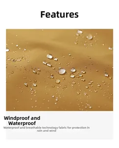 Close-up of ginger yellow waterproof fabric showing water droplets on outdoor jacket