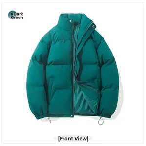 Close-up of dark green puffer jacket featuring quilted texture and elastic cuffs