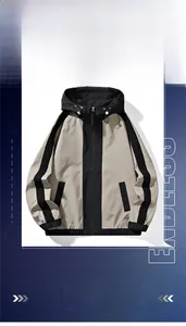 Detail of men's casual outdoor hooded jacket in beige and black patchwork design
