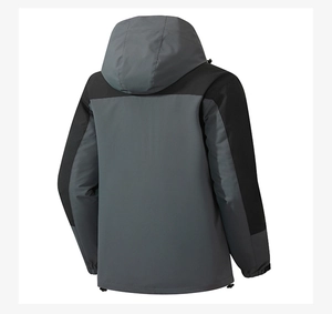 Detail view of back panel seams on waterproof hooded outdoor jacket with contrast paneling