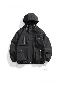 Detailed view of waterproof outdoor cargo jacket showing large utility pockets and hood