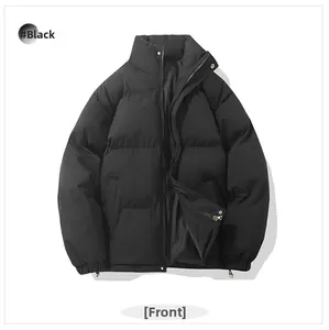 Detailed front view of black puffer jacket with zipper, snap buttons and elastic cuffs