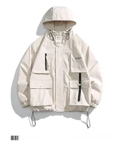 Detail of apricot cargo jacket showing chest print and multi-pocket functional design