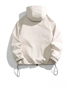 Rear view of apricot windproof outdoor jacket showing adjustable drawstring hem detail