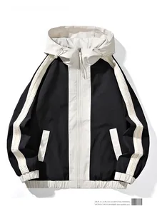 Flat lay of a black and white hooded jacket with zipper closure and adjustable drawstrings
