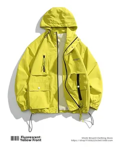 Detail view of fluorescent yellow heavy-weight outdoor cargo jacket with large flip pockets
