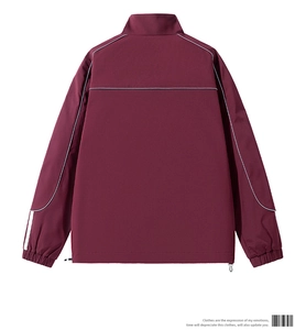 Rear view of burgundy windbreaker jacket with white piping details and adjustable hem