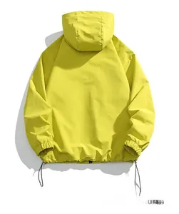 Rear view of fluorescent yellow men's hooded outdoor jacket with adjustable drawstring hem