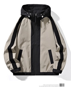 Detailed flat lay of a beige and black windbreaker jacket with a drawstring hood and zip