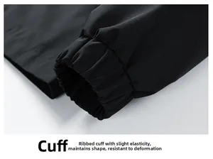 Close-up of elastic ribbed cuff on black windproof jacket with high density knit texture