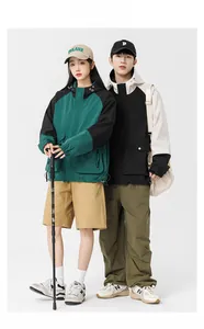 Outdoor hooded windbreaker and cargo pants set for men and women in studio photoshoot