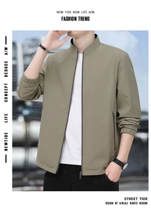 Close-up of khaki business jacket with metal zipper, stand collar and elastic cuffs