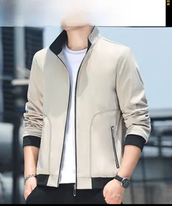 Detailed close-up of light beige slim fit jacket featuring black stand-up collar and metal zipper