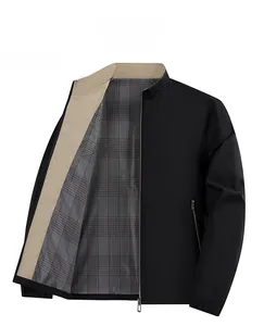 Detail of men's black stand collar jacket with gray plaid lining and zipper pocket