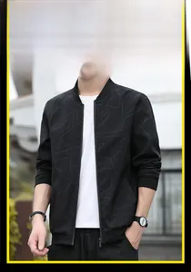 Close-up of black slim fit jacket featuring subtle geometric patterns and ribbed baseball collar