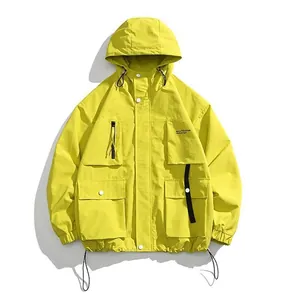 Mustard yellow men's hooded tactical jacket with multiple cargo pockets and waterproof fabric