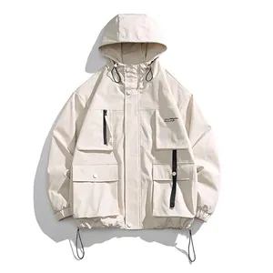 Men's waterproof tactical jacket with hood and multiple utility pockets in light khaki