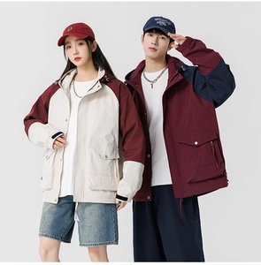 Detail of color-block windbreaker with adjustable velcro cuffs and multi-pocket design