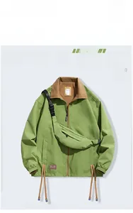 Close-up of grass green outdoor jacket with brown collar and multi-functional chest bag