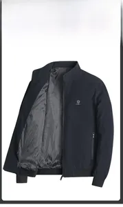 Detail of dark blue jacket showing striped lining and ribbed cuffs with zipper pocket