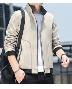 Detailed view of khaki casual jacket with black contrast ribbing and stand collar