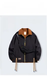 Detail of waterproof standing collar jacket with contrast brown lining and zipper