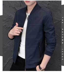 Detailed view of the dark blue textured zip-up jacket with ribbed collar and cuffs