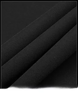 Close-up detail of premium black woven fabric texture on a men's casual stand-collar jacket