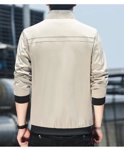 Rear view of khaki slim fit jacket showing stand collar and ribbed hem on model