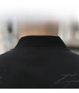 Detail of ribbed knit collar and sleek marble pattern on a men's casual stand collar jacket
