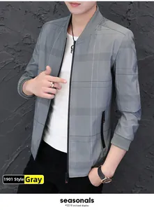 Detail view of men's grey bomber jacket with fine grid pattern and stand-up collar