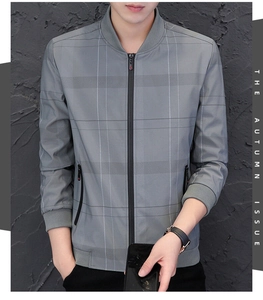 Detailed view of grey plaid bomber jacket featuring zip pockets and ribbed cuffs