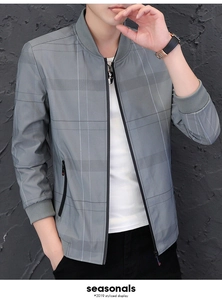 Detail of grey plaid jacket featuring a ribbed baseball collar and zipper closure