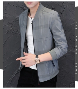 Detail of grey plaid bomber jacket with ribbed collar and sleek metal zipper closure
