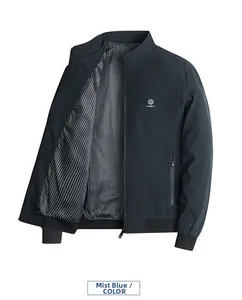 Detail of fog blue men's bomber jacket with silver shield logo and striped lining