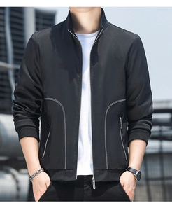 Close-up of black men's jacket with white curved contrast stitching and metal zipper
