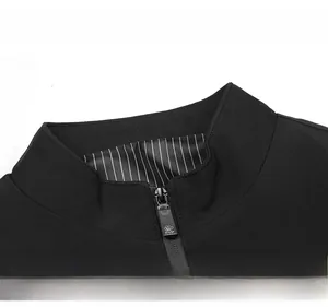 Detail of a stand-up collar on a black casual business jacket with striped lining