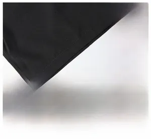 Detail view of double-stitched hem on black quick-dry men's athletic shorts