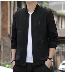 Close-up of black casual bomber jacket featuring maple leaf print and ribbed stand collar